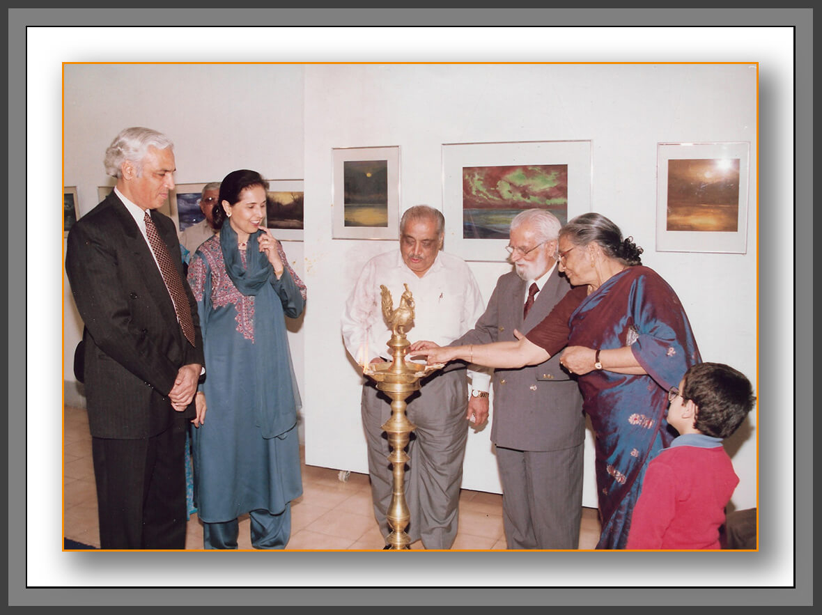 Manohar Kaul and Mohini Kaul lighting the ceremonial lamp